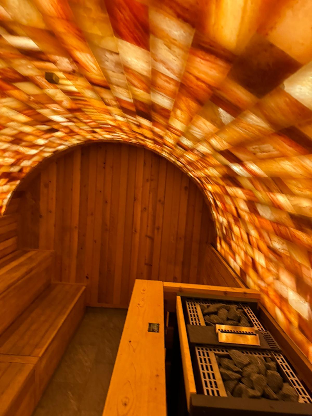 Finnish heater set within a salt-lined cabin