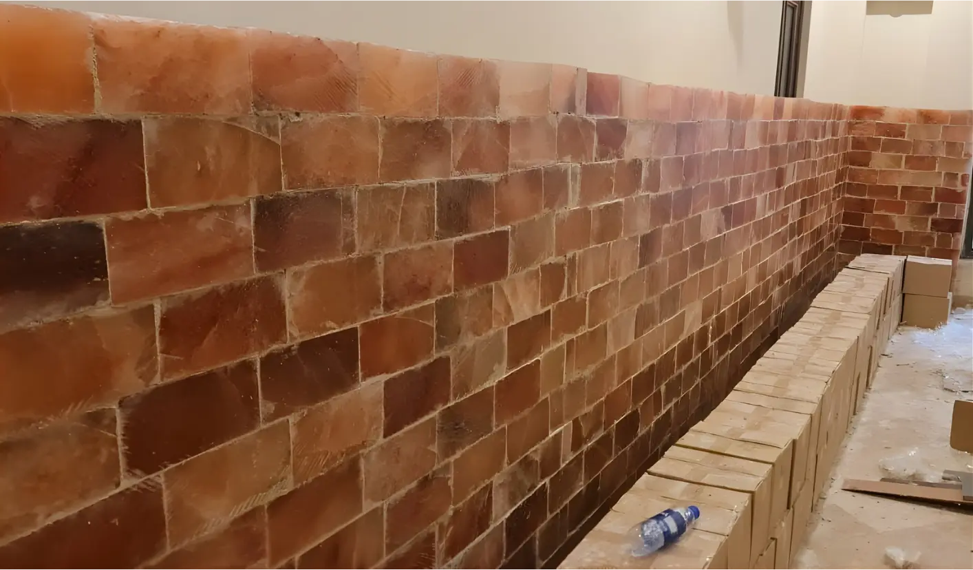 A hand-set salt brick wall in progress